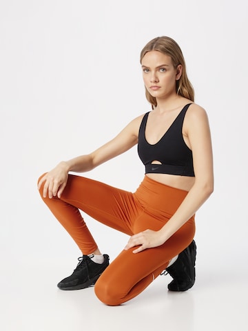 NIKE Skinny Športne hlače 'One' | oranžna barva