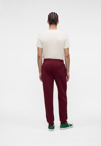 Tapered Pantaloni 'CHUCK' di CONVERSE in rosso