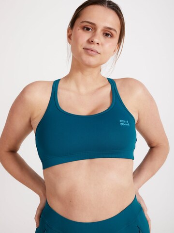 SPORTKIND Sport bh 'Crossed Straps' in Groen: voorkant