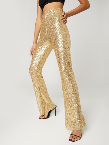 Hoermanseder x About You Pants 'Elsa' in Gold: front