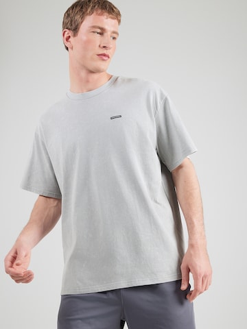 T-Shirt fonctionnel UNDER ARMOUR en gris : devant