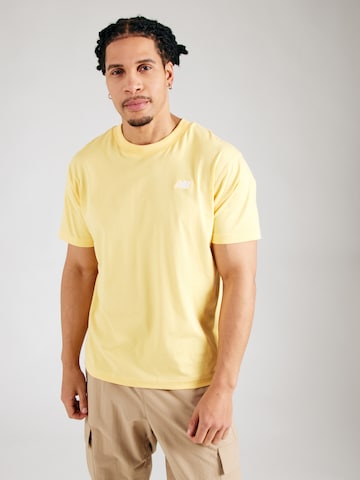 T-Shirt 'Essentials' new balance en jaune : devant