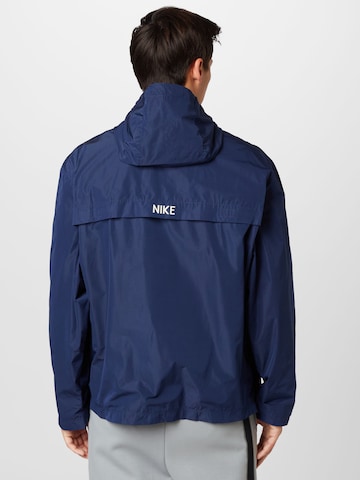 Veste de sport NIKE en bleu