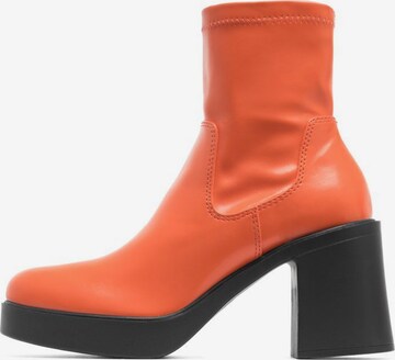 Bianco Ankle Boots in Orange: front