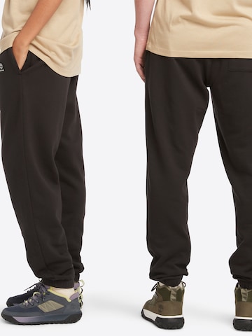 TIMBERLAND Normalny krój Spodnie w kolorze brązowy