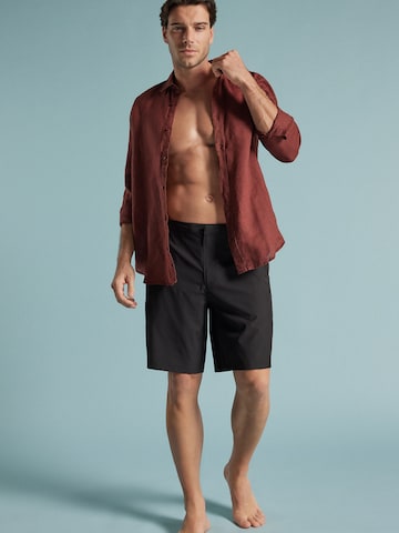 IUMAN Intimissimi Swim Trunks in Black: front