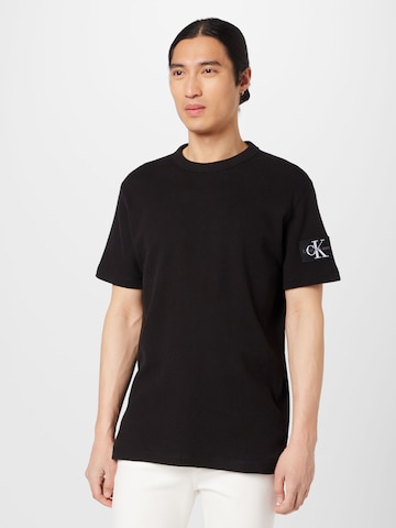 T-Shirt Calvin Klein Jeans en noir : devant