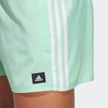 ADIDAS SPORTSWEAR Athletic Swim Trunks in Green