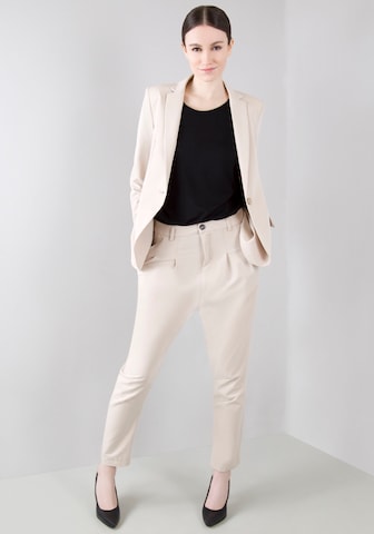 IMPERIAL Tapered Pleat-Front Pants in Beige