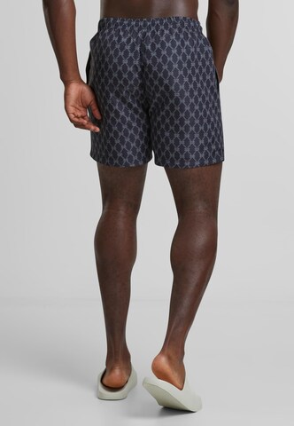 Karl Kani Plavky 'KM251-041-1 Signature Monogram Aop' - Modrá
