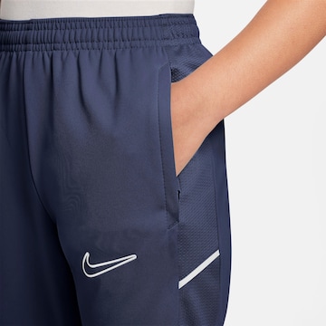 mėlyna NIKE Standartinis Sportinės kelnės 'Academy25'