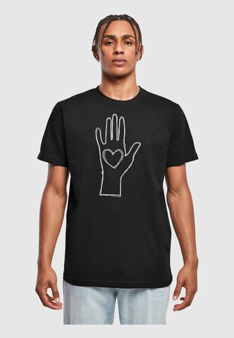 Merchcode Shirt 'Peace - Scribble Hand Heart' in Zwart: voorkant