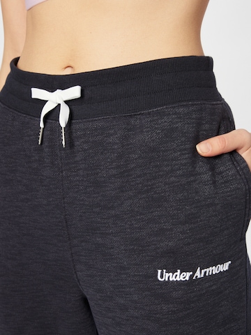 Tapered Pantaloni sportivi di UNDER ARMOUR in nero