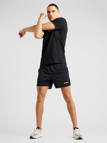 NIKE Regular Workout Pants 'TRACK CLUB' in Black
