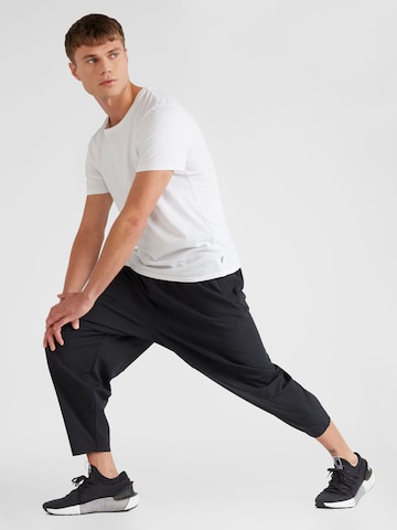 Regular Pantalon de sport 'Unstoppable Airvent' UNDER ARMOUR en noir