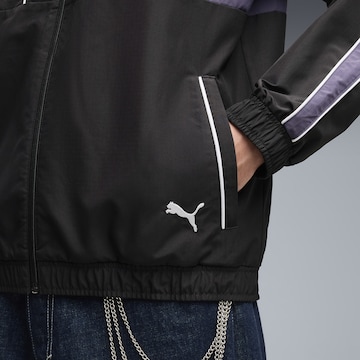 PUMA Sportjacke 'T7' in Schwarz