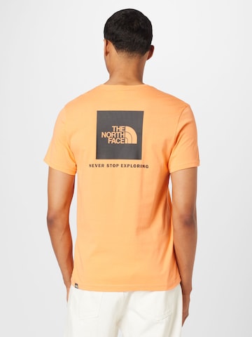 THE NORTH FACE Klasický střih Funkční tričko 'Red Box' – oranžová