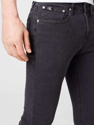 pilka Calvin Klein Jeans Siauras Džinsai