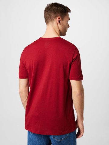 OAKLEY Klasický střih Funkční tričko 'Bark New' – červená