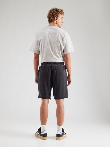 Largi Pantaloni sport 'TREVOR' de la ELLESSE pe negru