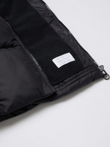 MANGO KIDS Prehodna jakna 'Ali5' | črna barva