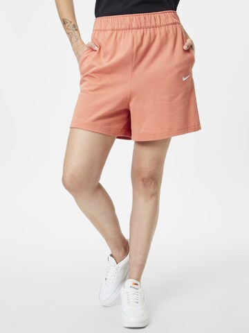 Nike Sportswear Loosefit Broek in Oranje: voorkant
