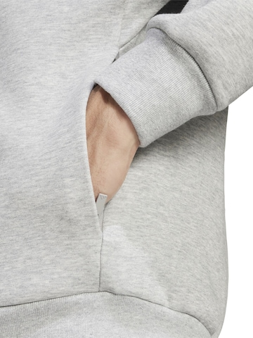ADIDAS SPORTSWEAR - Chaqueta de chándal en gris