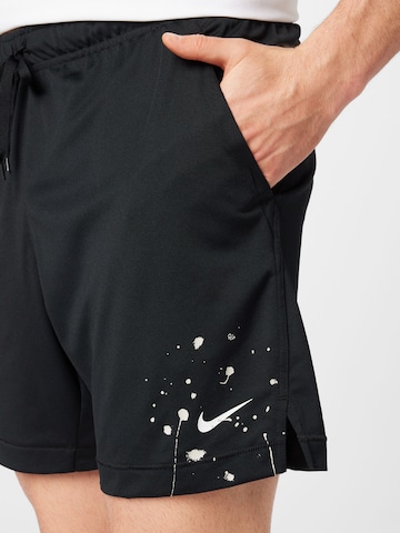 NIKE Regular Sports trousers in Black