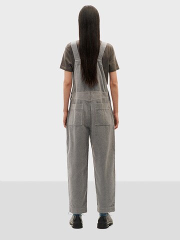 Loosefit Pantaloni con pettorina 'Luz' di Thinking MU in grigio