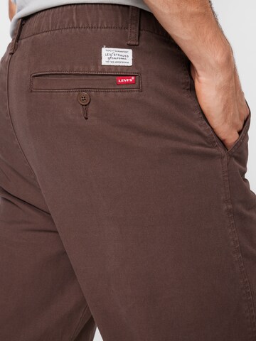 LEVI'S ® Alt kitsenev Chino-püksid 'XX Chino EZ Taper', värv pruun