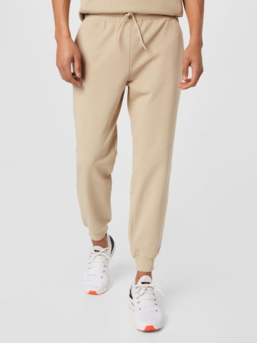 4F Tapered Workout Pants in Beige: front