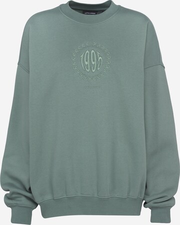 UNFOLLOWED x ABOUT YOU Sweatshirt 'CLIQUE' in Groen: voorkant