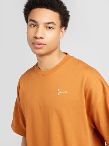 Karl Kani Bluser & t-shirts i orange