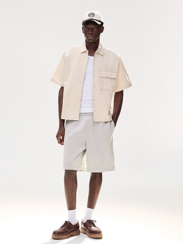 BershkaBaggy Hlače - siva boja