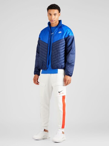 Nike Sportswear Between-season jacket in Blue