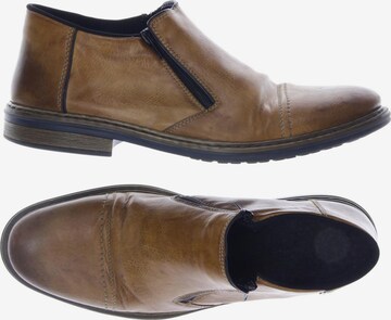 Rieker Flats & Loafers in 47 in Brown: front