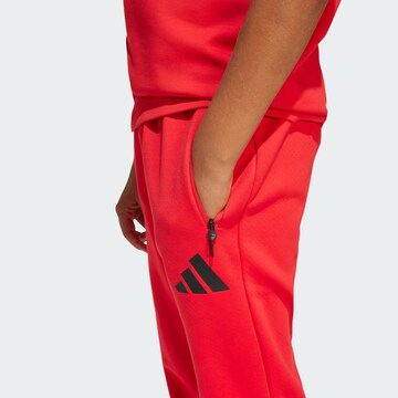 ADIDAS SPORTSWEAR Tapered Sports trousers ' Z.N.E. ' in Red