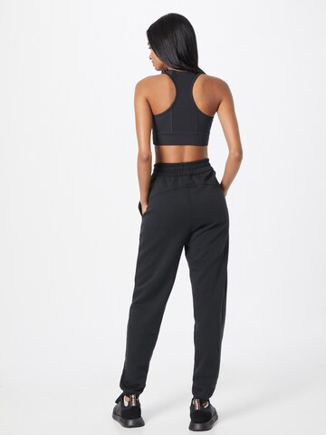 Effilé Pantalon de sport Reebok en gris