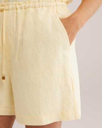 WE Fashion Ohlapna forma Hlače | rumena barva