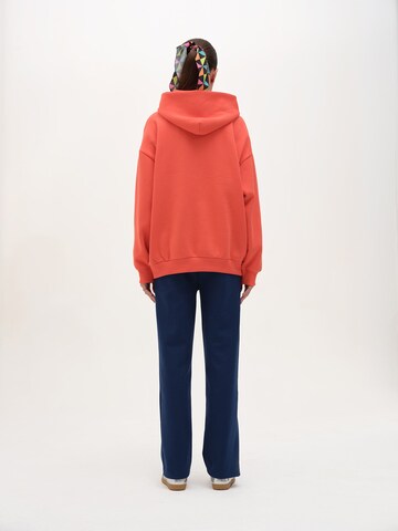 Rockupy Sweatshirt 'Yadriel'‌‌‌‌‌ in Orange
