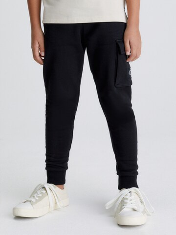 Calvin Klein Jeans Tapered Pants in Black: front