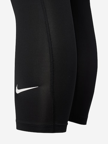 NIKE Skinny Urheiluhousut värissä musta