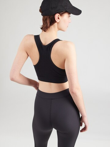 Reebok Bustier Športni top | črna barva