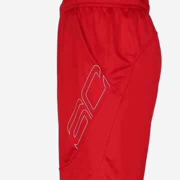Loosefit Pantalon de sport UNDER ARMOUR en rouge