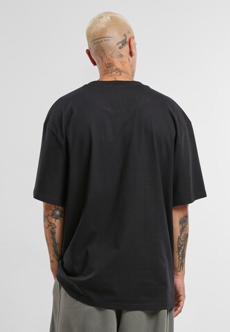 melns Karl Kani T-Krekls 'Old English Chrome'