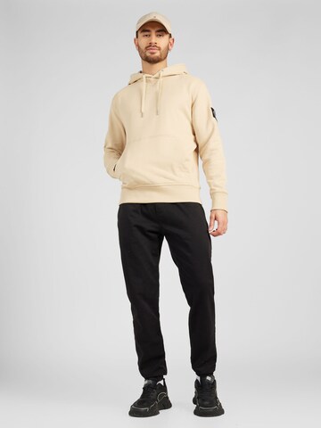 Calvin Klein Jeans Collegepaita värissä beige