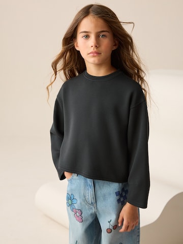 melns Next T-Krekls: no priekšpuses