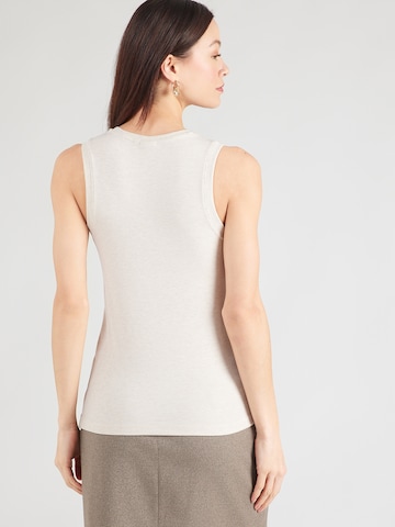 Top de la ROUGE EDIT pe bej