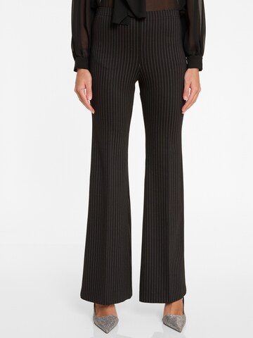 Ana Alcazar Flared Trousers with creases 'Anuri' in Black: front