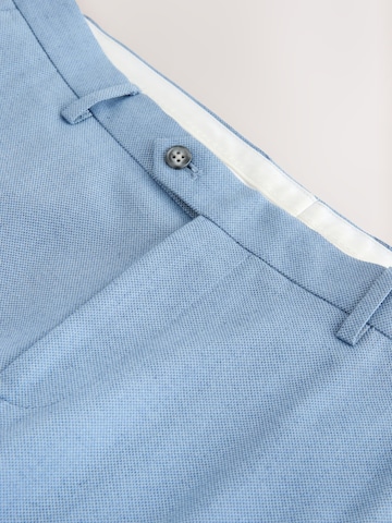 Coupe slim Pantalon à plis Next en bleu